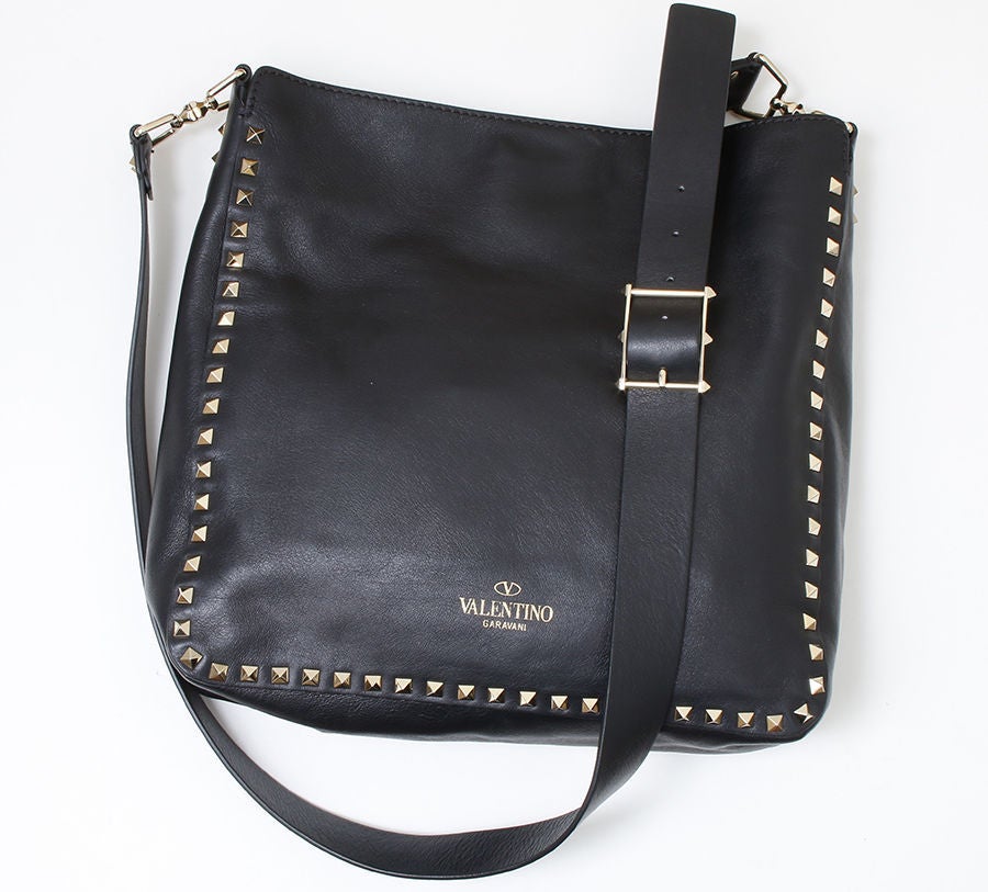 Currently sold Valentino cross body bag. Adjustable cross body strap ranging from 18-22 inches. Flip lock closure with gold tone hardware, one inside zip pocket, unlined, leather, Made in Italy. Strap Drop:	18-22.  Retail $2,545.00
