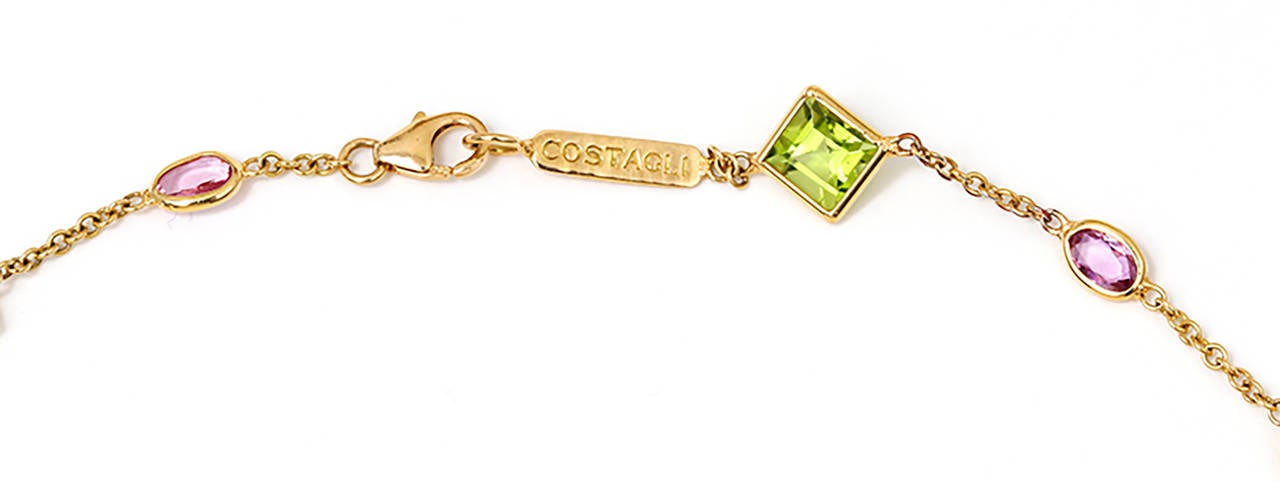  From the Florentine Collection,this necklace features square-cut peridot 5.50 ctw, enhanced by oval-shaped pink sapphires 2.75 ctw, set in 18k yellow gold. Necklace measures apx. 17 inches in length. Total weight is 9.5 grams. Marked NEW YORK