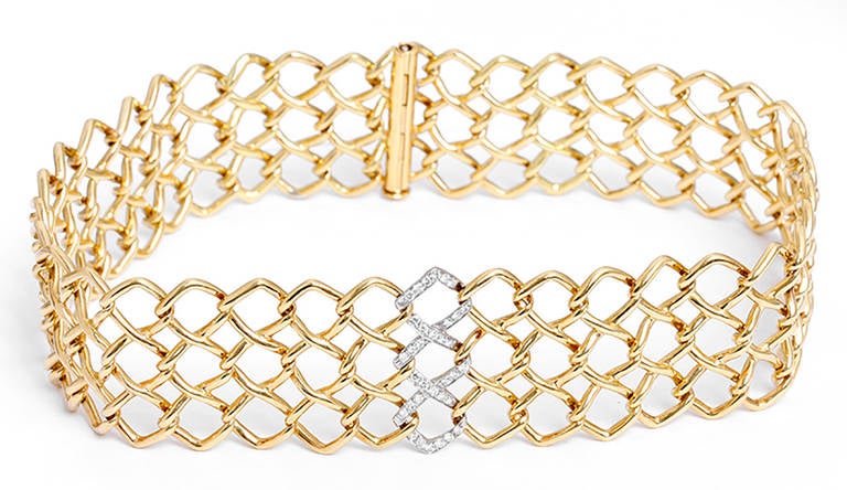 This beautiful set is stamped 1980, T & CO., Paloma Picasso. Both are 18k yellow gold featuring a central row of pave diamonds; total diamond weight is apx. 0.68 carats.  The wide choker necklace is apx. 15 inches in length and the bracelet is apx.