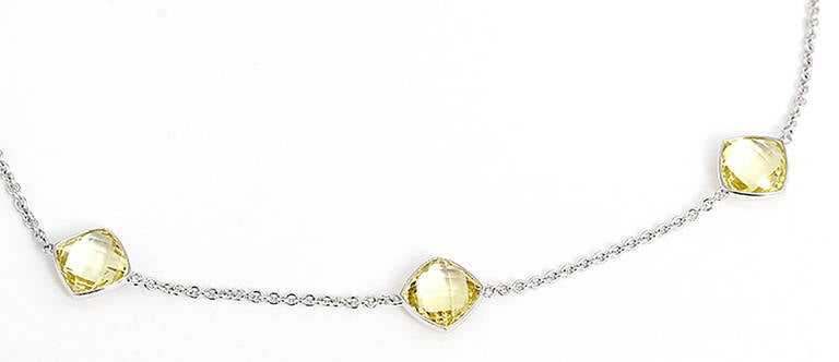 This necklace features 5 yellow quartz stones that measure 1/4 inch wide and long. The stones are evenly spaced and the total necklace weight is 6.6 grams. Necklace length is 16 inches.