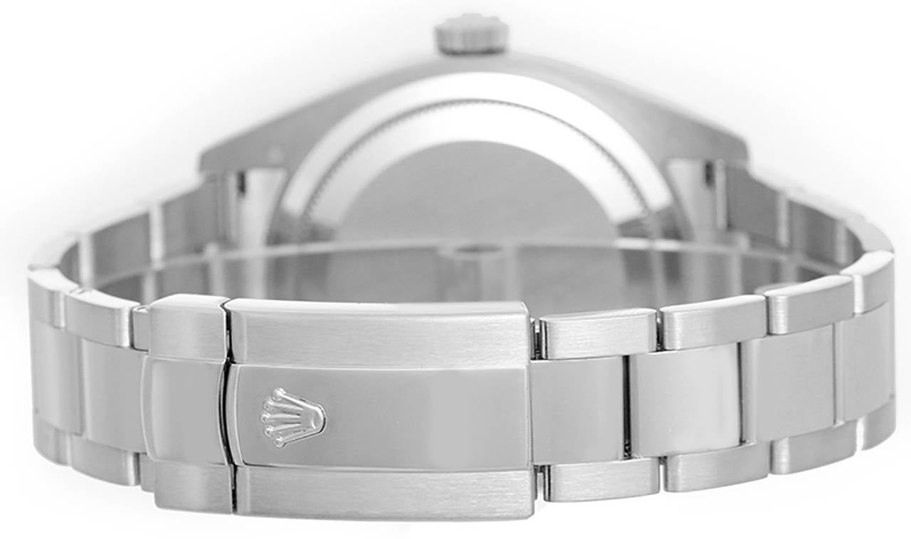 Automatic movement, Saros Annual Calendar, GMT 2-time zone feature. 18k white gold case with rotating fluted bezel (42mm diameter). Ivory dial with Roman numerals; second time zone displayed on offset dial, date at 3 o'clock, month indicator display