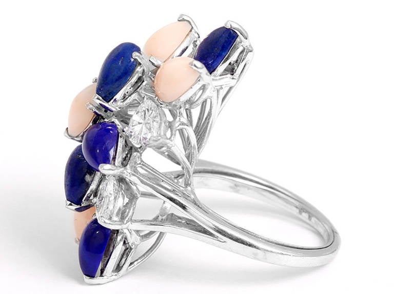 This amazing ring is made up of 2.4 carats of Pear shaped VS2 white diamonds and 6 pear shaped lapis stones and 4 light coral pear shaped stones. This ring is 1.25 inches in length and .75 inches in width. It is stamped PT and Tiffany and Co. The