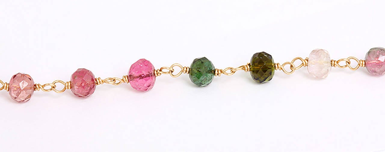 Composed of various colored tourmaline faceted beads, earpendants en suite.  Necklace 20 inches in length with a total weight of 14.2 grams and is signed.