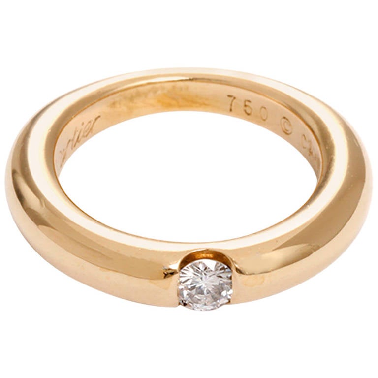 Cartier Ellipse Diamond Gold Solitaire Ring For Sale at 1stdibs