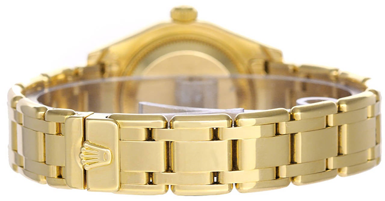 Automatic winding, 31 jewels, Quickset, sapphire crystal. 18k yellow gold case with full factory diamond bezel (29mm diameter). Factory meteorite diamond dial. 18k yellow gold Pearlmaster bracelet. Pre-owned with box and books.