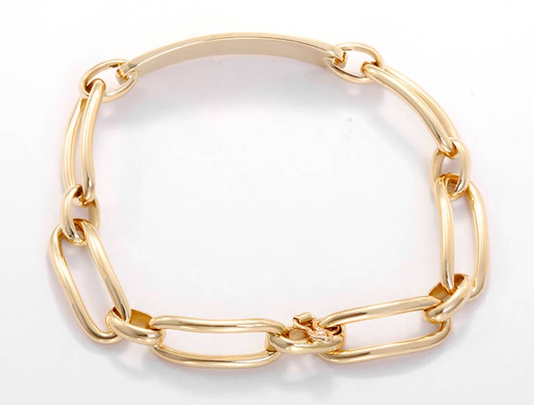 This chic 18k yellow gold id link bracelet is light and comfortable to wear. It is apx. 7 inches in length, with a total weight of 24.5 grams. This bracelet can be worn alone or stacked with bangles and other bracelets.