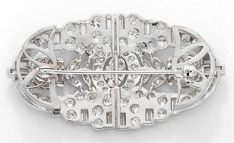 This stunning platinum brooch contains 18 baguette cut diamonds apx. 1.00 ctw., numerous round single cut and round brilliant cut diamonds apx. 2.84 ctw., and eight marquise brilliant cut diamonds apx. 0.35 ctw. It measures apx. 2-inches in length