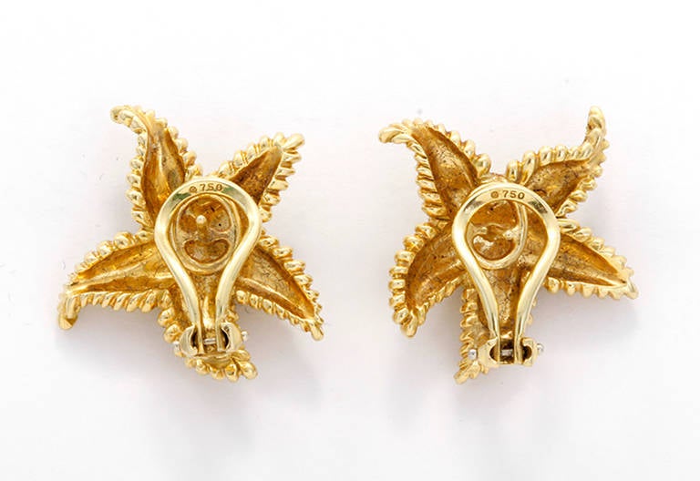 These amazing starfish earrings are perfect for any look! They are 18k yellow gold with gold beaded texturing. Omega-style clips and posts. Signed Tiffany & Co. They measure apx. 1-inch in diameter with a total weight of 16.3 grams.