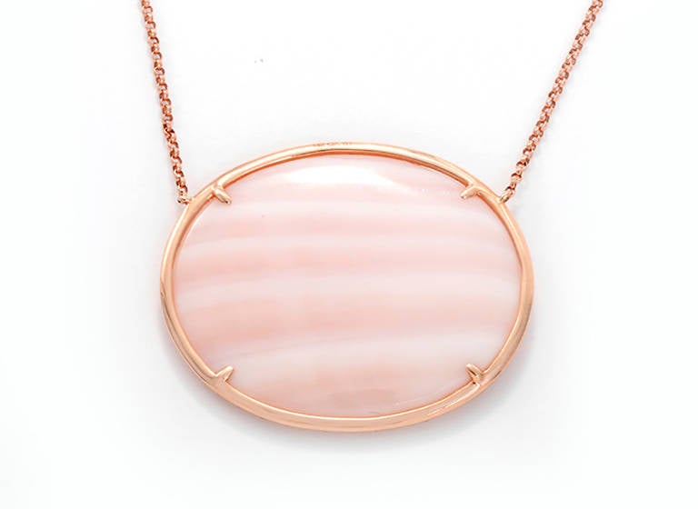 This beautiful necklace features a pink mother of pearl centered by a border of 0.28 carats of diamonds. The pendant measures apx. 1-3/8 inches by 1-1/8 inches. The necklace features a delicate chain and measures apx. 16-inches in length. Total