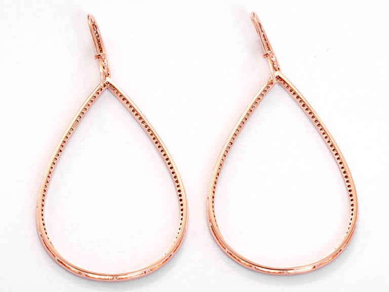 These 18k rose gold earrings feature 1.17 carats of J-K-L-color and I-clarity diamonds. They measure 2-1/2 inches x 1-1/4 inches. Total weight is 7.5 grams.