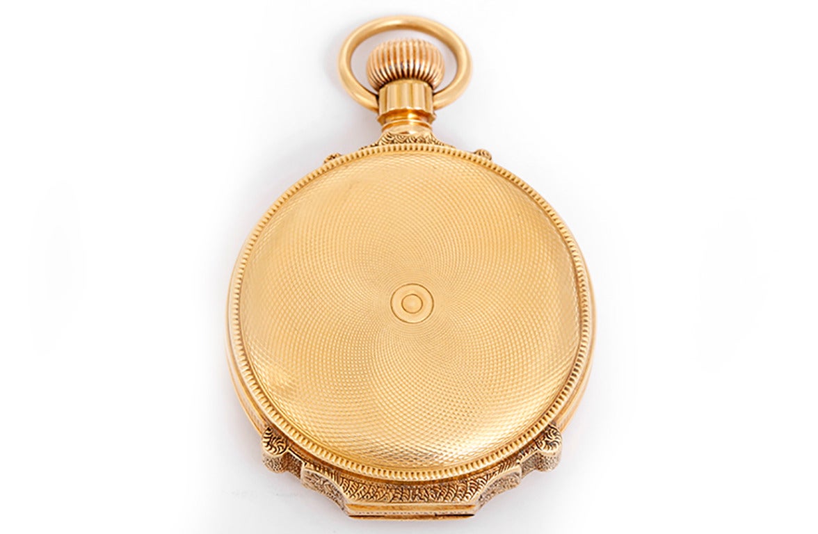 13 jewels, 18k yellow gold hunting case with engine-turned back and monogramed case front, 10 size, 41mm diameter. White enamel dial with black Roman numerals, subsidiary seconds. Circa 1882.