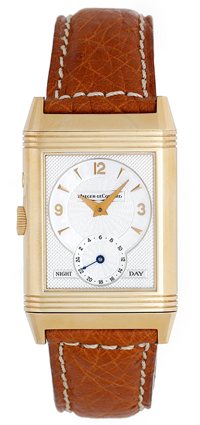 Ref. 270154 270.1.54. Manual-wind movement, 21 jewels. 18k yellow gold Reverso case, 26mm x 42mm. Silvered guilloche dial with black Arabic numerals and subsidiary seconds dial, reverses to reveal silvered guilloche two-tone dial with gold markers
