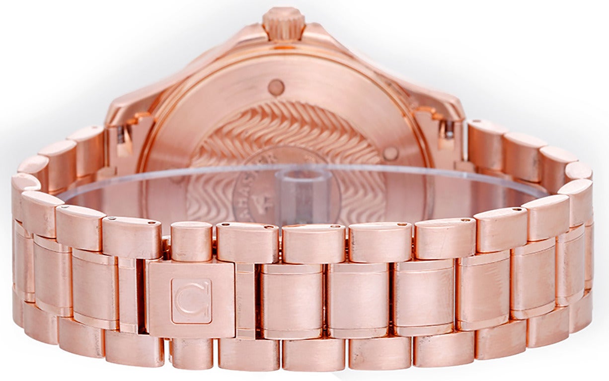 Automatic movement. 18k rose gold case with rotating bezel, 42mm diameter. Black wave-textured dial with luminous-style hour markers. 18k rose gold Omega bracelet, will fit apx. 7-inch wrist. Pre-owned with Omega box.
