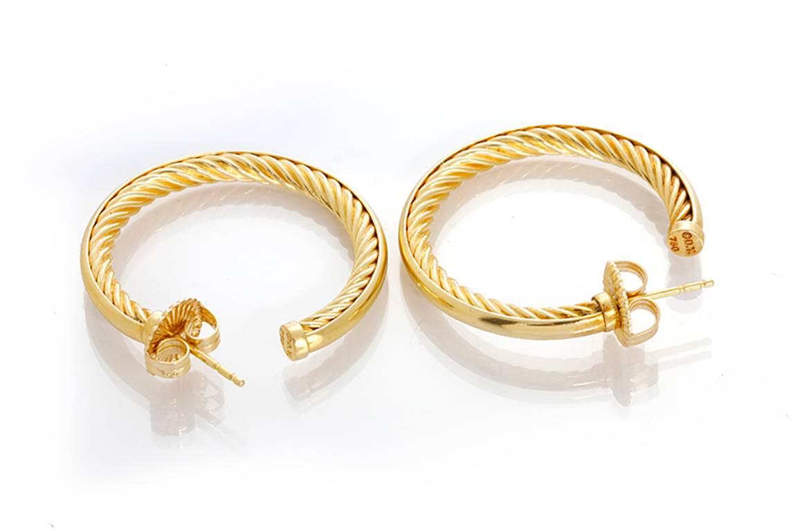 These amazing David Yurman Crossover hoop earrings in 18k yellow gold are perfect for everyday wear! Earrings measure apx. 31mm in diameter and weigh 9.4 grams. Current Replacement Value: $1,950.00