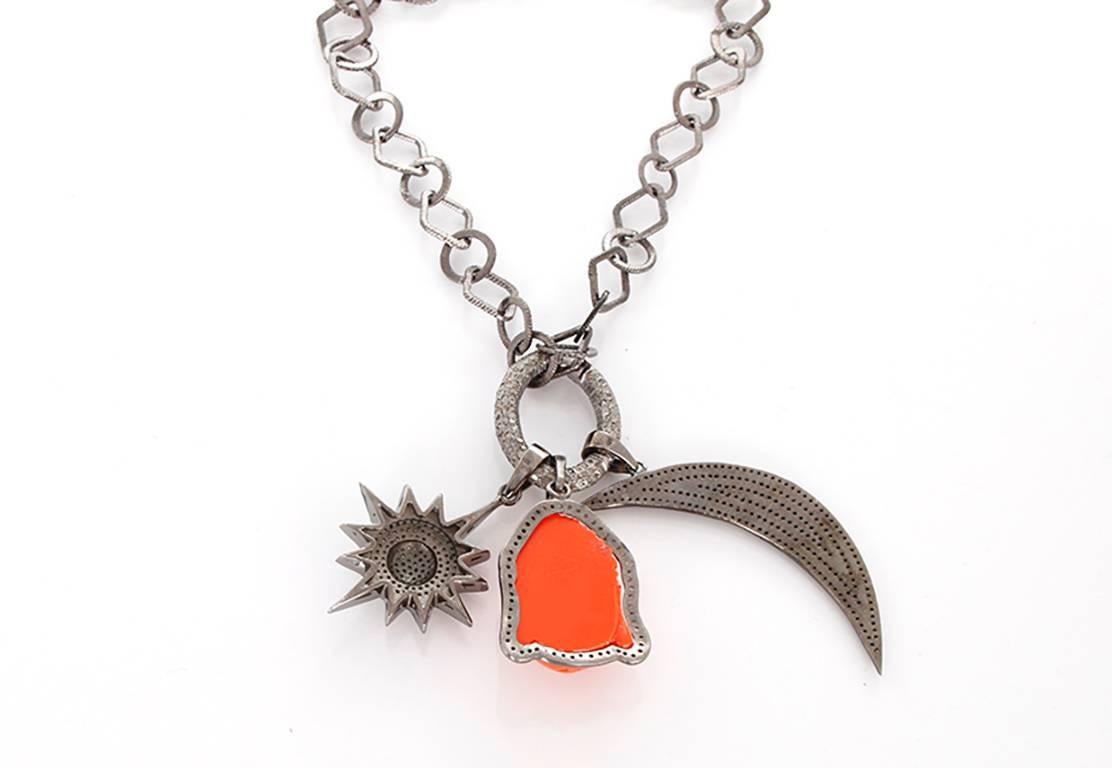 This beautiful bohemian inspired necklace features  diamond crescent moon and star pendants with a coral Buddha pendant outlined by  diamonds on a diamond oval clasp; all set in oxidized silver. Sterling silver chain measures apx. 36-inches in