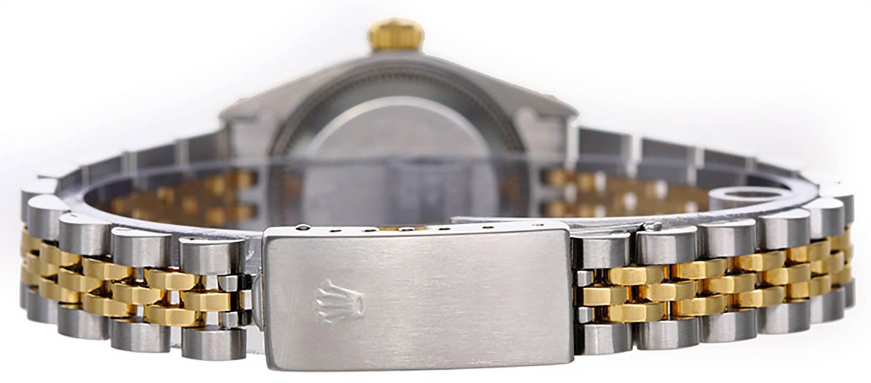 Automatic winding, 29 jewels, Quickset date, sapphire crystal. Stainless steel case and fluted bezel  (26mm diameter). White dial with gold Roman numerals. Stainless steel and 18k yellow gold Jubilee bracelet. Pre-owned with box. Current Replacement