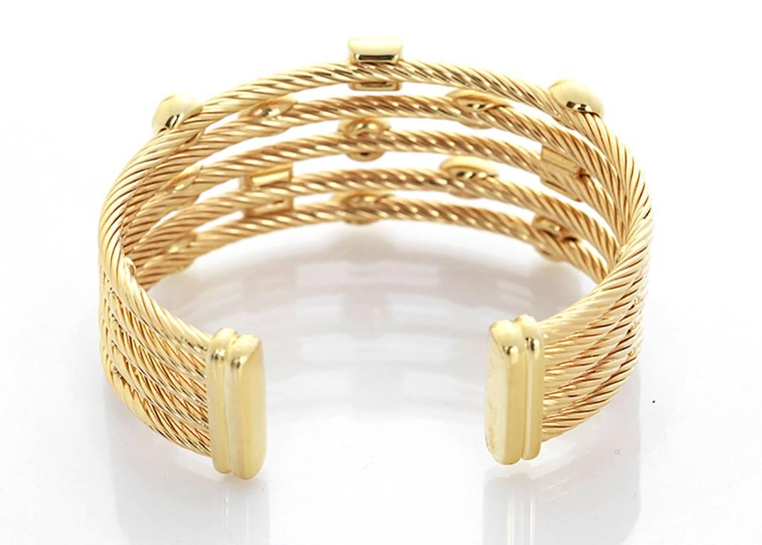 This amazing David Yurman wide cuff bracelet is a part of the Confetti Collection; and features 0.55 ctw. of pave diamonds set in 18k yellow gold. Bracelet measures apx. 1-inch in width. Total weight is 57.2 grams. Signed, 'DY 750'. Retail Price: