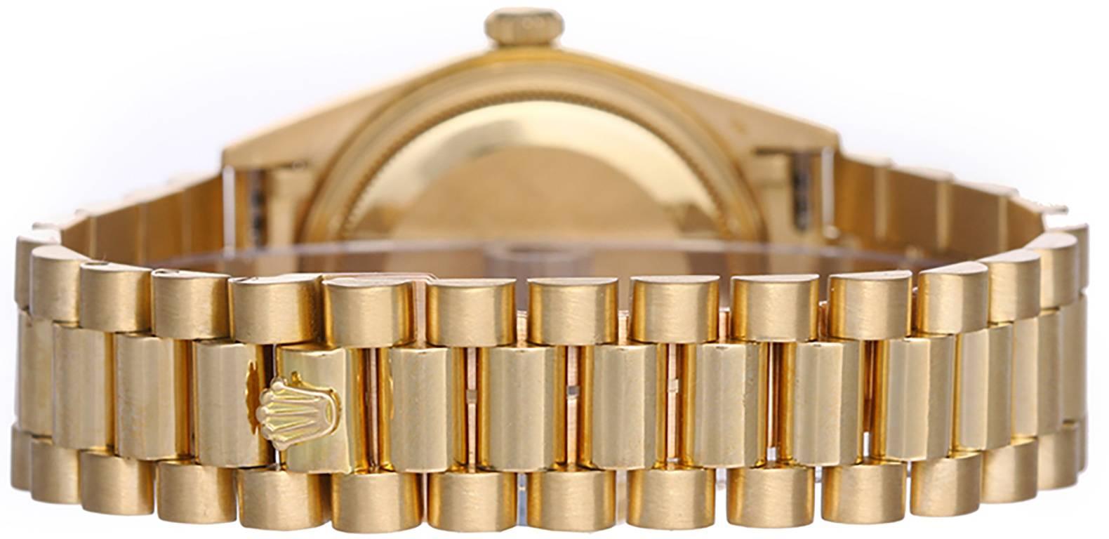 Automatic winding; quick-set; sapphire crystal. 18k yellow gold case with fluted bezel (36mm diameter). Silvered dial with factory diamond hour markers. 18k yellow gold hidden-clasp President bracelet. Pre-owned with box and books.  