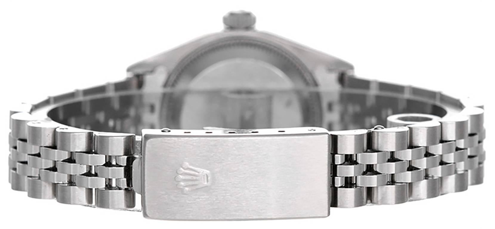 Automatic winding; 31 jewel; sapphire crystal. Stainless steel case with 18k white gold fluted bezel (26mm diameter). Silvered dial with stick markers. Stainless steel Jubilee bracelet. Pre-owned with custom box. Current Replacement Value: $7,250.00