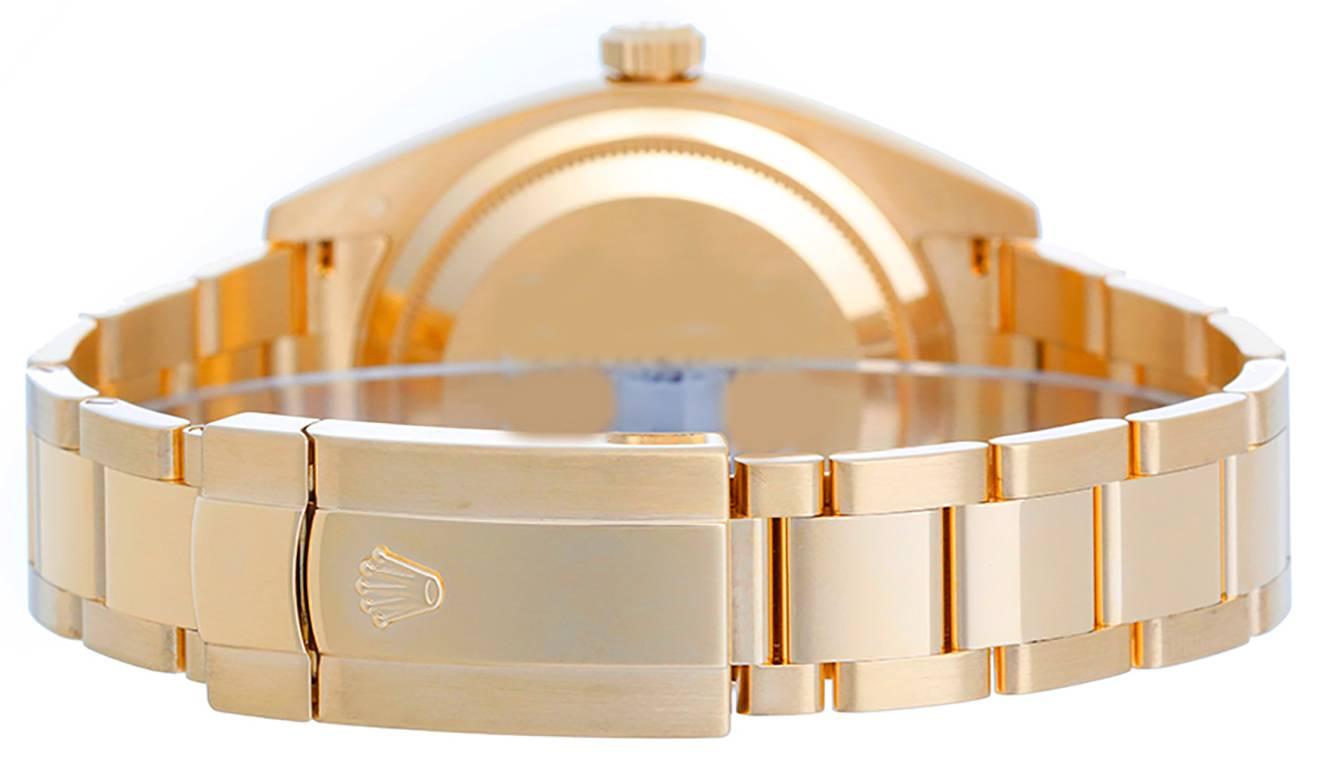Automatic winding, perpetual calendar and GMT feature. 18k yellow gold case with fluted bezel  (42mm diameter). Champagne dial with gold Arabic numerals; date; second time zone; month indicator. 18k yellow gold Oyster bracelet. Pre-owned with Rolex