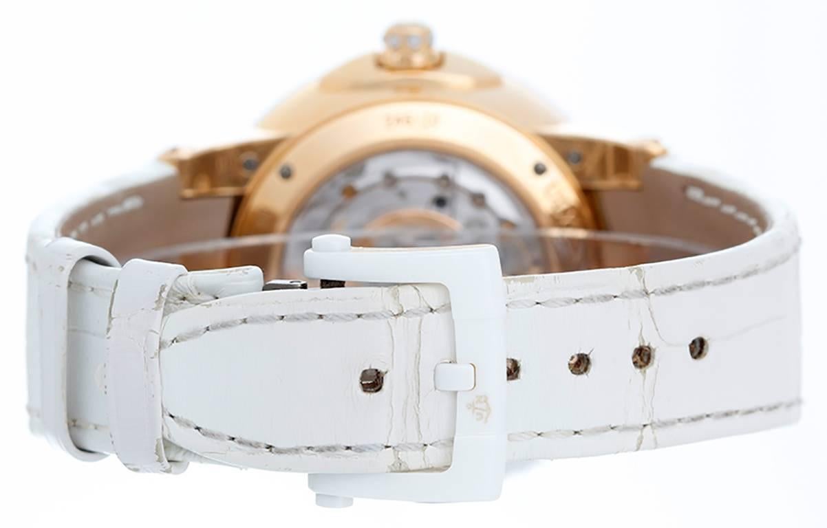  Automatic winding. 18k rose gold case with exposition back to view diamond rotor  (40mm diameter). Mother of pearl dial with 4 pave diamond Roman numerals; date; dual time indicator; diamond subseconds dial. White croc strap band with. Pre-owned