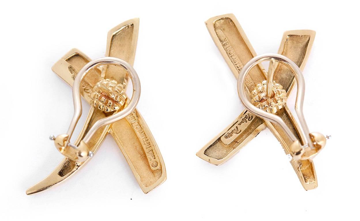 These amazing Paloma Picasso for Tiffany & Co. earrings feature the X-Cross design in 18k yellow gold completed by posts with omega backs. Marked, Paloma Picasso Tiffany & Co 1983 18K. Earrings measure apx. 1-1/8 inches x 7/8 inch. Total weight is