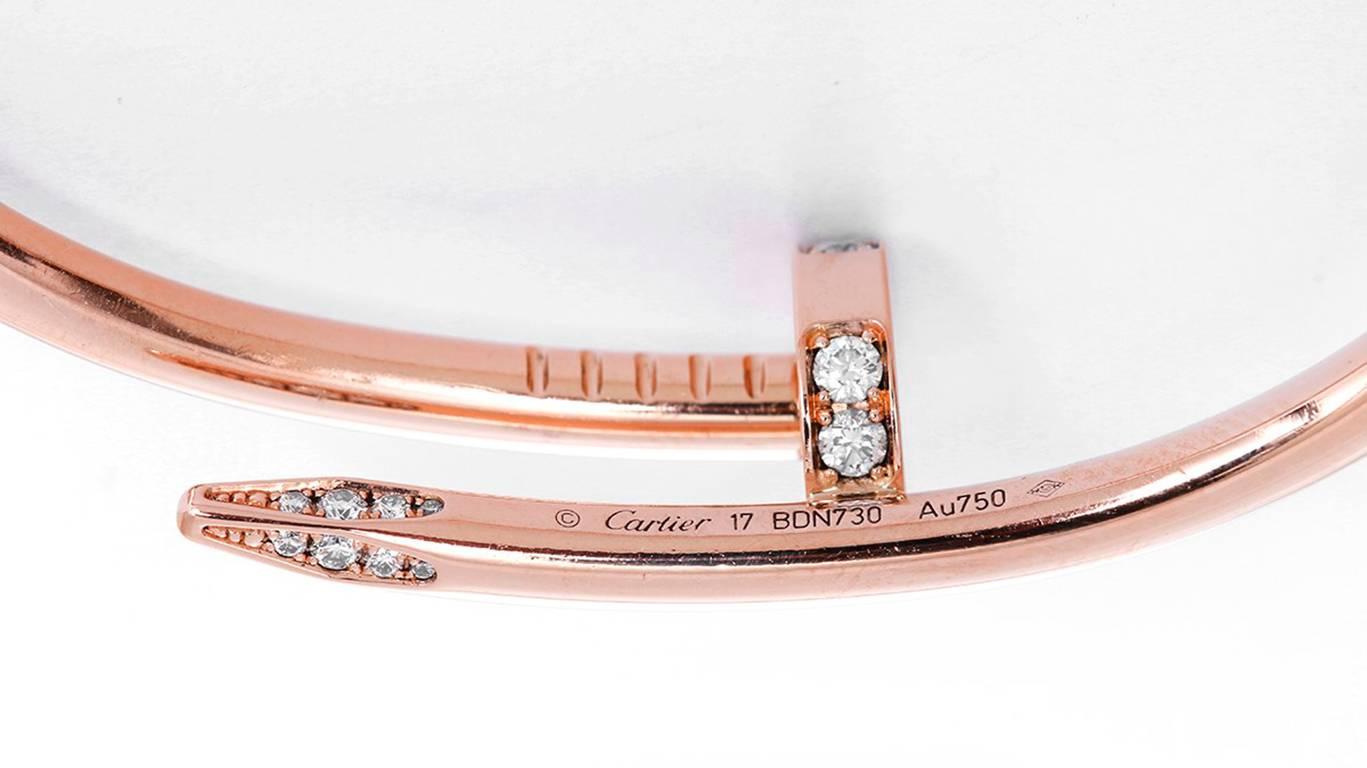 This bracelet is a part of the Juste un Clou Collection and features pave diamonds set in 18k pink gold. Signed Cartier 17 BDN730 Au750. Size 17. Total weight is 31.0 grams. Cartier box and certificate included.