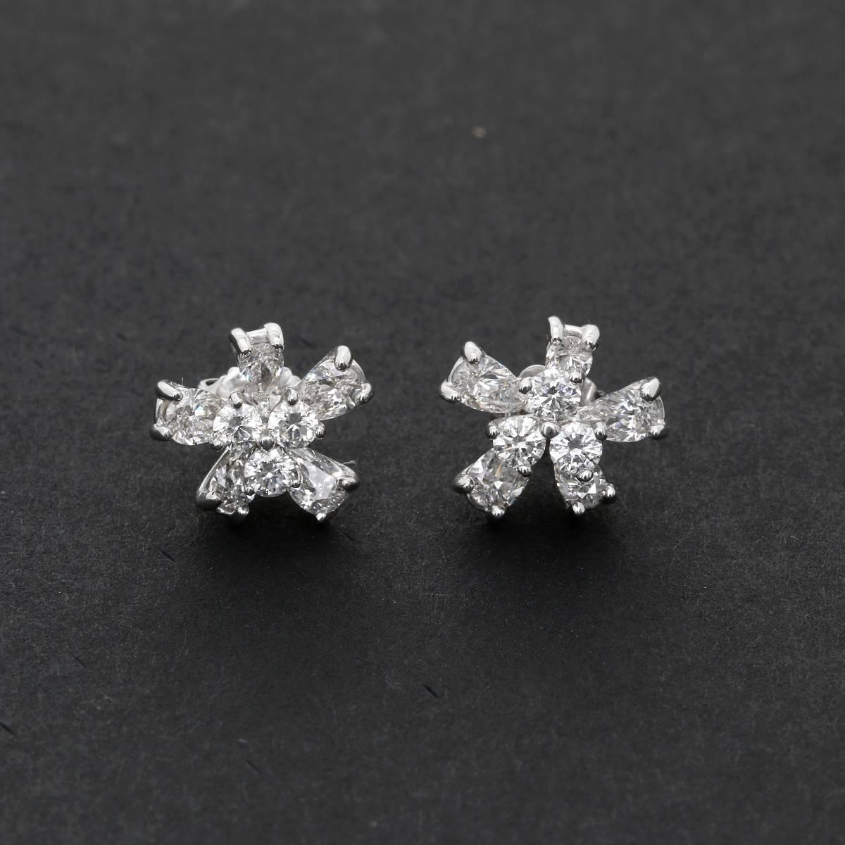 Stunning 14k White Gold and Diamond Flower Stud Earrings - . These stunning earrings feature 1.5 carats of diamonds (SI1-SI2 clarity, G color) set in 14k white gold.  Earrings measure apx, 12 mm  in length with jacket. Total weight is 4.5 grams. 