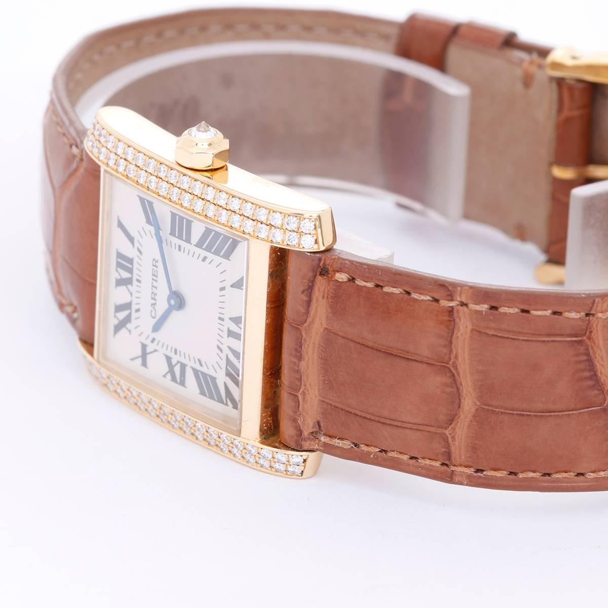 Cartier Tank Francaise Midsize 18k Yellow Gold Watch WE1017R8 - Quartz. 18k yellow gold case with 2 rows of diamonds on either side (25mm x 30mm). Ivory colored dial with black Roman numerals. Strap with yellow gold buckle. Pre-owned with Cartier