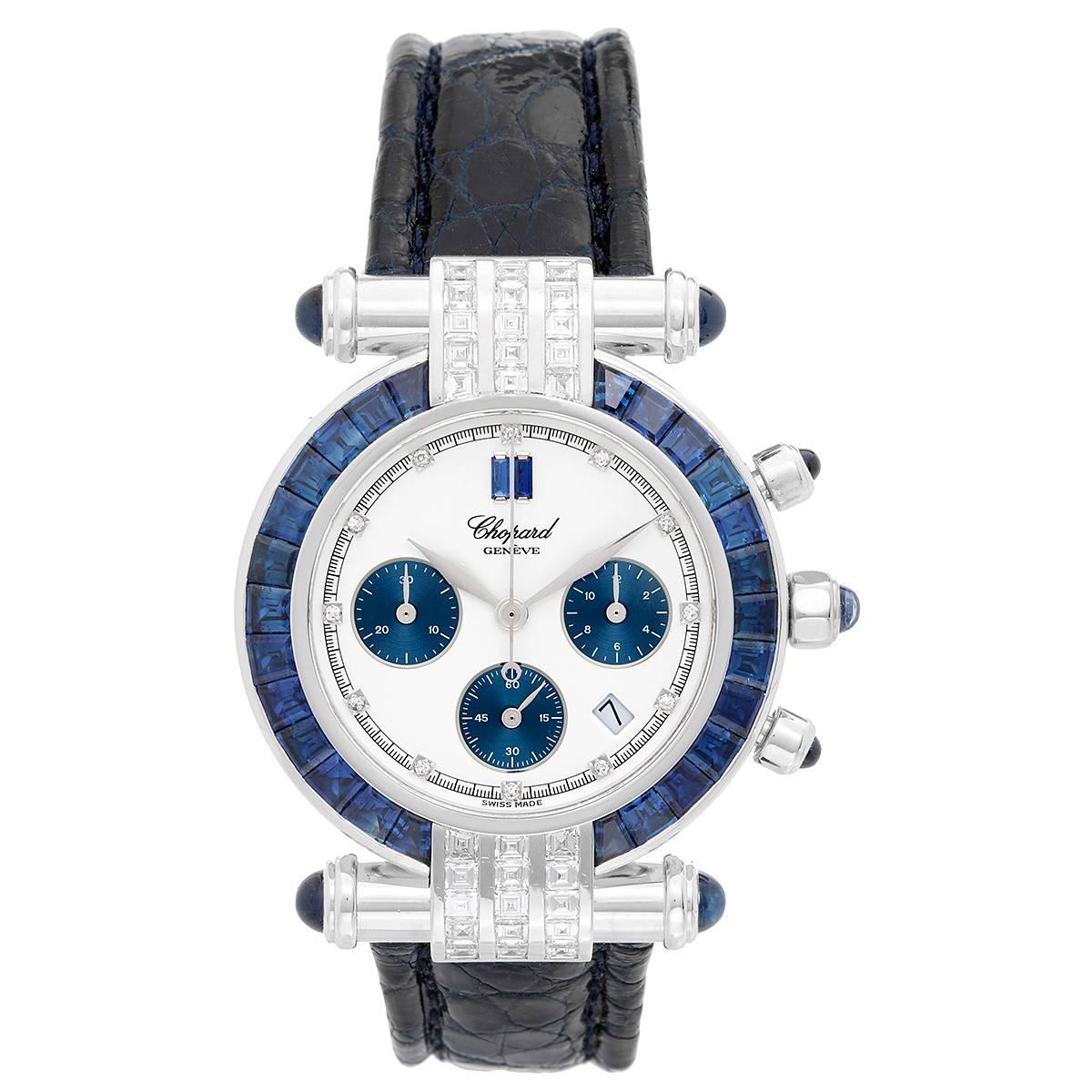 Chopard Imperial White Gold with Diamonds and Sapphires -  Quartz. Round White Gold ( 38 mm ). 26 Sapphire bezel. White dial with diamond markers; 3 blue sub dials. Blue alligator strap. Pre-owned with box.