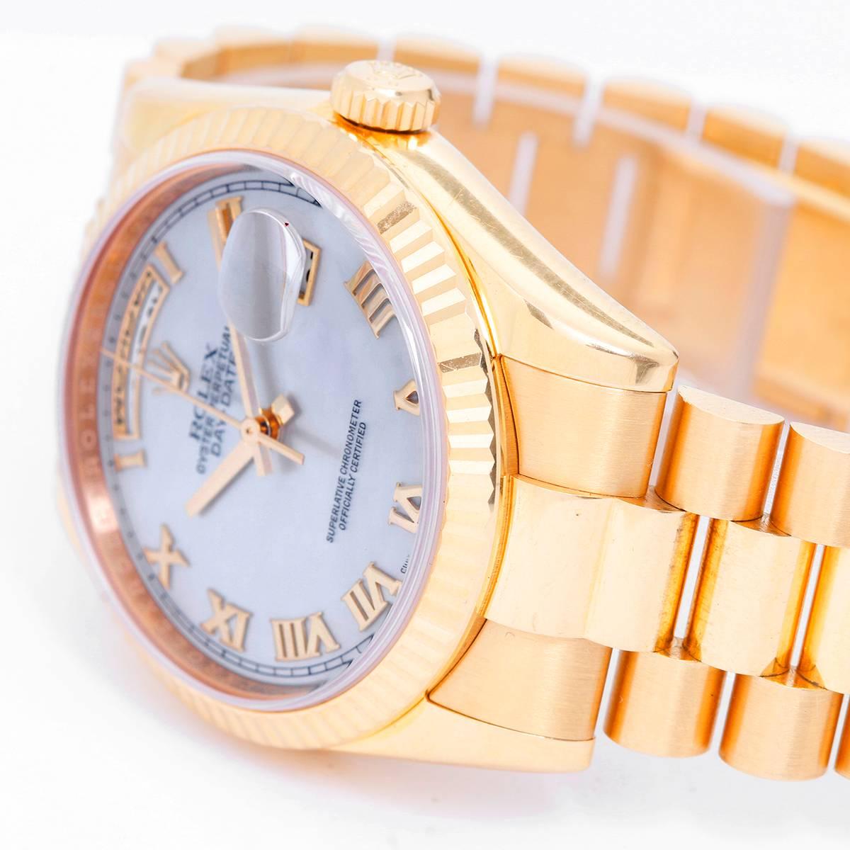 Rolex President Day-Date Men's 18k Gold Watch 118238 White Roman -  Automatic winding, 31 jewels, Quickset, sapphire crystal. 18k yellow gold case with fluted bezel (36mm diameter). Mother of pearl dial with raised gold Roman numerals. 18k yellow