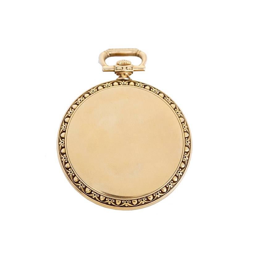 Tiffany & Co.Yellow Gold Pocket Watch -  Manual winding - movement by IWC. 18K yellow gold, unusual case. elegantly repose engraved bezel, ivory colored dial. Pre-owned with box