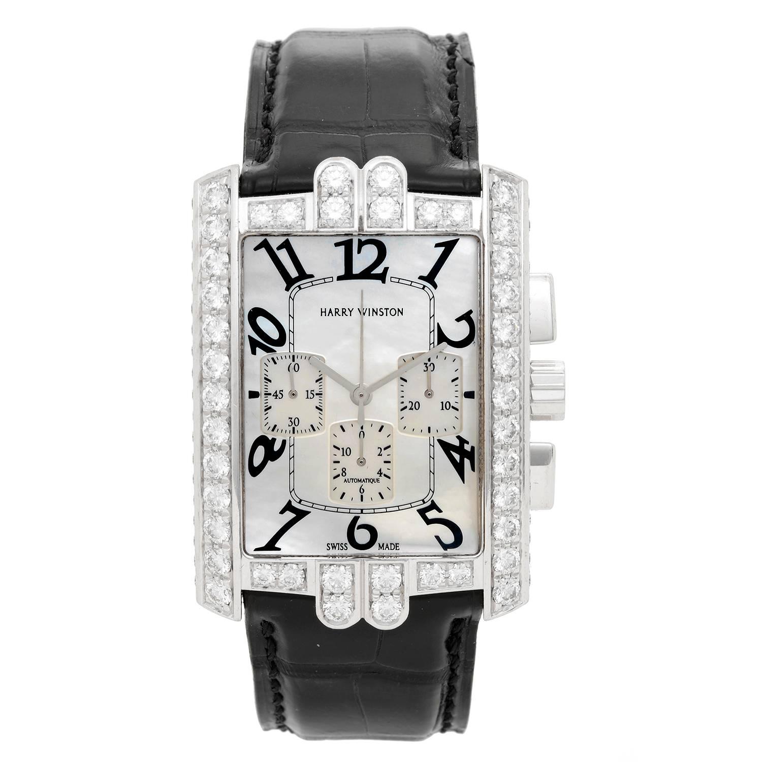 Harry Winston Avenue C Chrono Watch AVCACH32WW006 -  Automatic. 18K White Gold with 5.58 cts of pave diamonds around bezel, case, crown and buckle. White Mother of Pearl. Black alligator strap with 18K White gold tang buckle closure. Pre-owned with