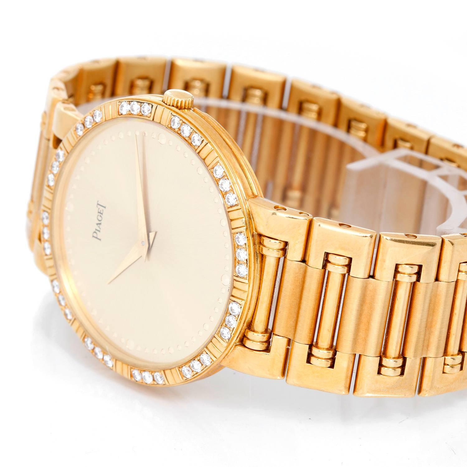 Piaget Dancer 18K Yellow Gold Watch -  Quartz. 18K Yellow Gold ( 31 mm ) with diamond bezel.  Round brilliant cut diamonds weighing 1.03 cts. Near Colorless and VSI Clarity Grade. Gold -tone with dot numerical style. Piaget 18K Yellow Gold bracelet