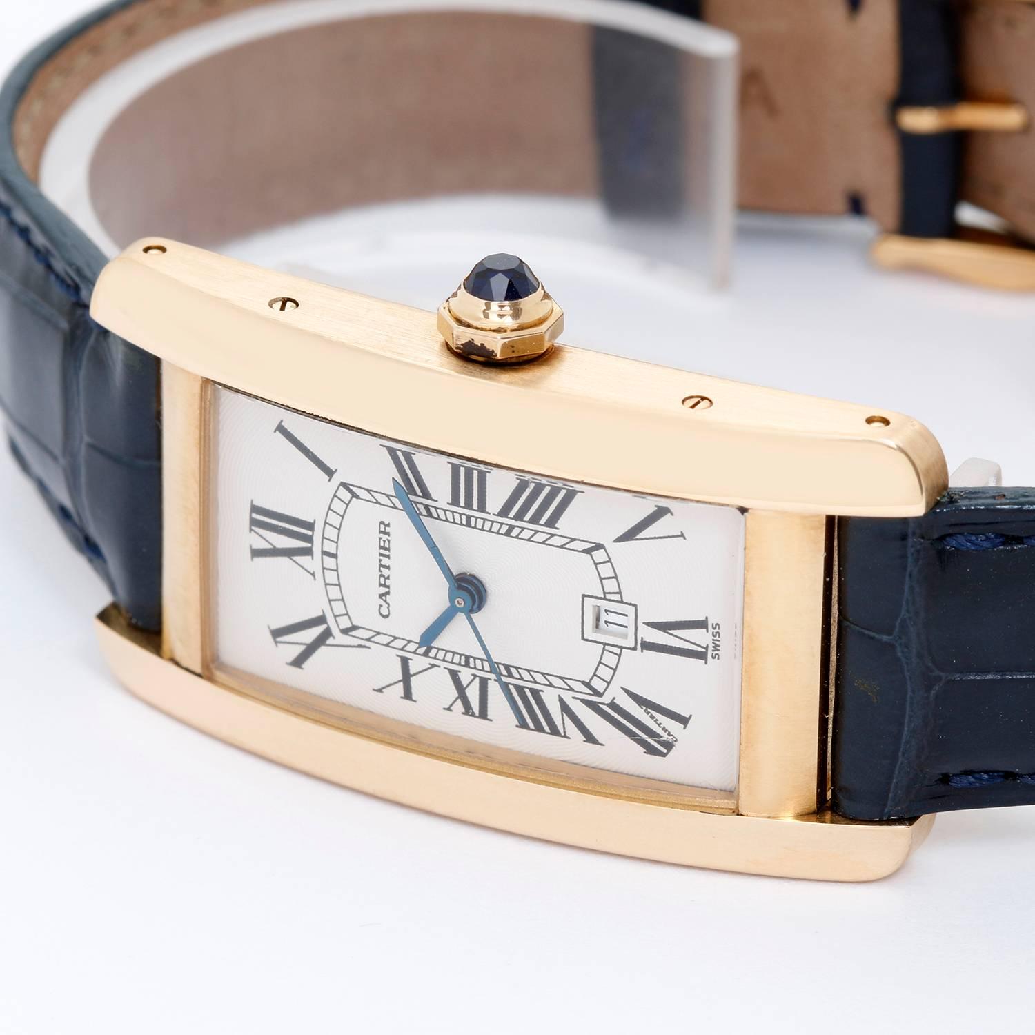 Cartier Tank Americaine (or American) Men's Gold Watch W2603156 -  Automatic winding with date. 18k yellow gold rectangular style case (28mm x 45mm). Silvered dial with black Roman numerals. Strap band with 18k yellow gold Cartier buckle. Pre-owned