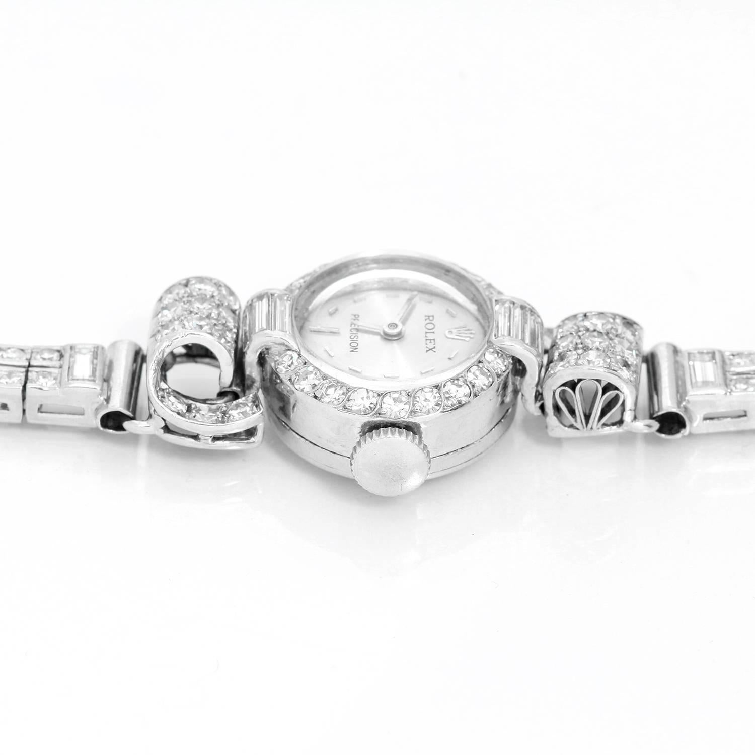 Vintage Ladies Rolex Diamond & Platinum Watch -  Mechanical sapphire crystal. Platinum case with diamond bezel(26mm). Silvered dial with stick markers. Platinum Bracelet adorned with diamonds. Pre-owned with custom box. estimated total diamond