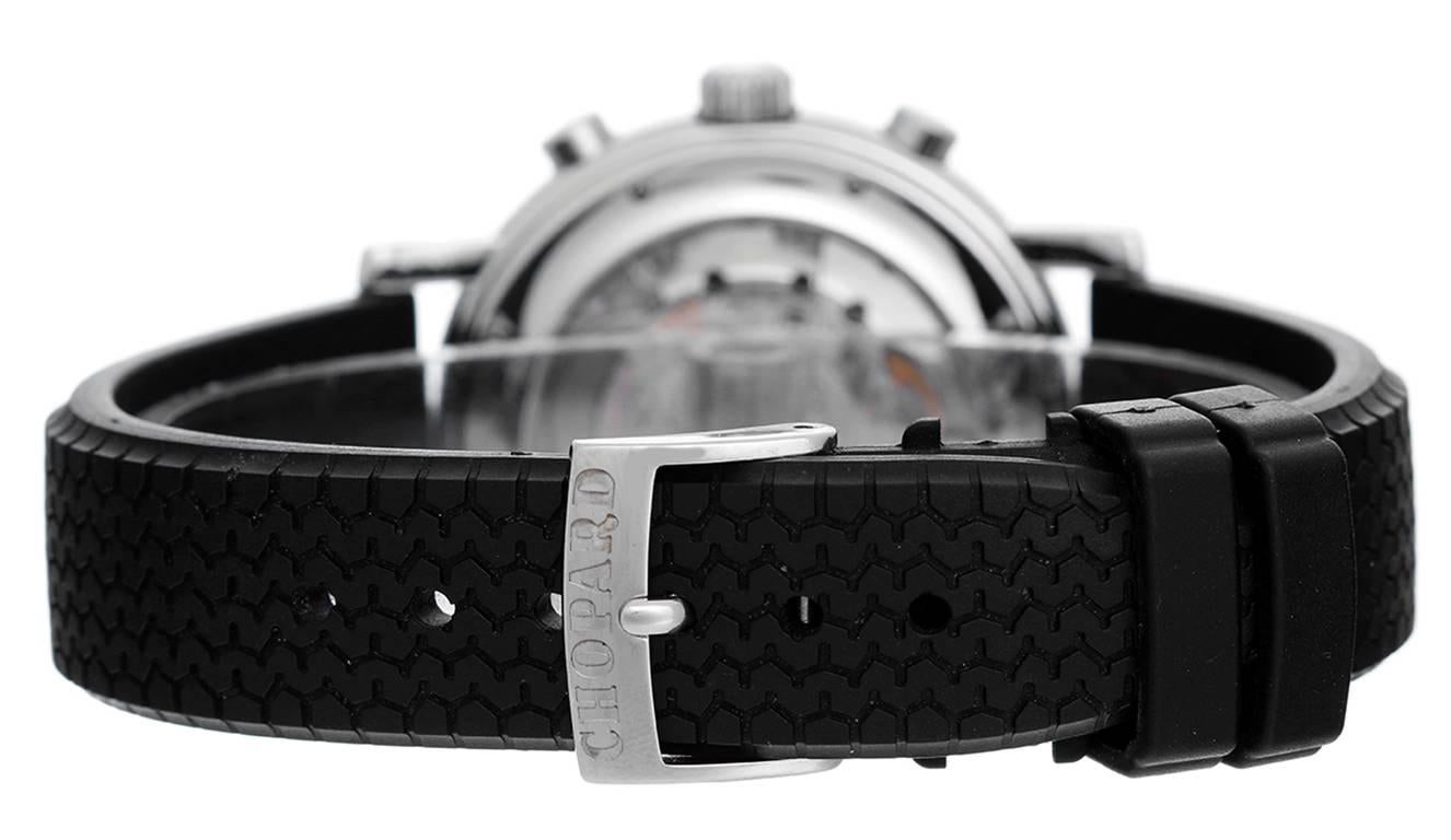 Automatic winding; chronograph; date. Stainless steel case with exposition back to view movement (39mm diameter). Black dial with hour, minutes and seconds recorders; subseconds at 3 o'clock; date between 4 & 5 o'clock. Chopard black rubber