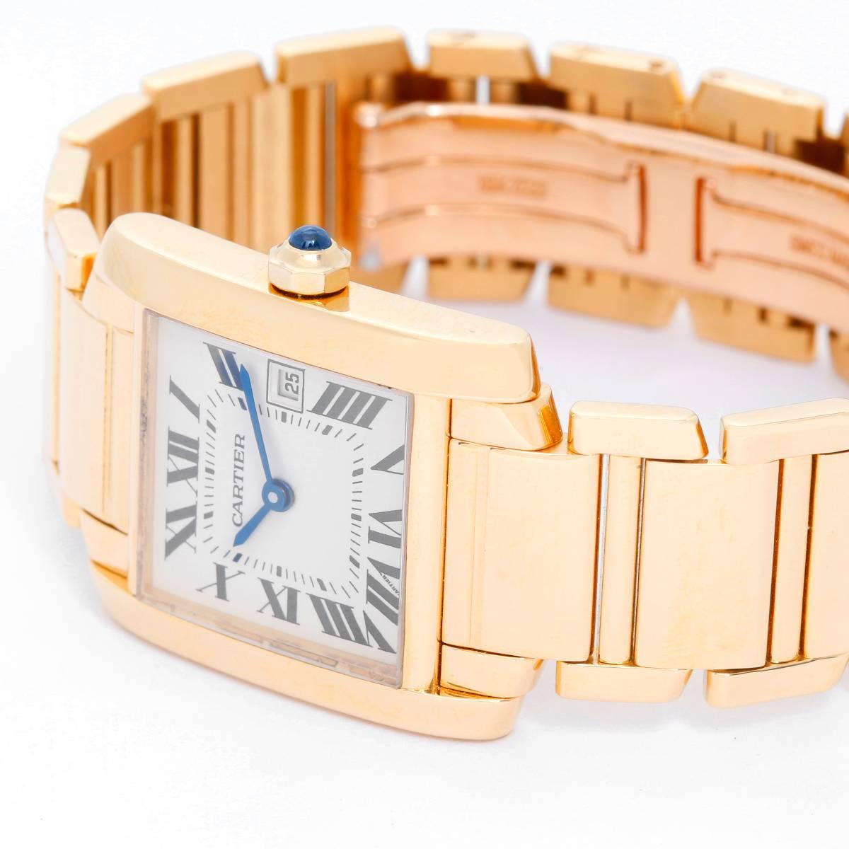 Cartier Tank Francaise Midsize 18k Yellow Gold Men's/Ladies Watch W50014N2 -  Quartz. 18k yellow gold  case; blue sapphire cabochon crown (25mm x 30mm). Ivory colored dial with black Roman numerals; date at 3 o'clock. 18k yellow gold Cartier Tank