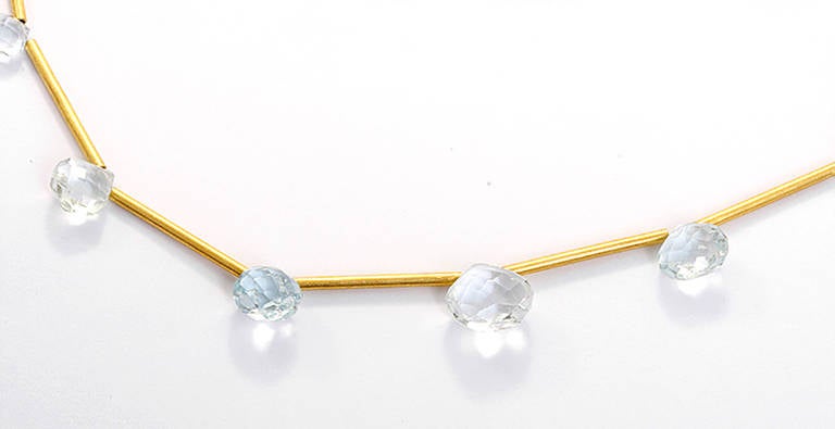 This is a beautiful 14k yellow gold set with aquamarine. The necklace measures apx. 15-1/2 to  apx. 16-3/4 inches in length and is adjustable. The earring hoop diameter measures apx. 5/8- inch with a drop length of 1-1/8 inches.  Total weight is