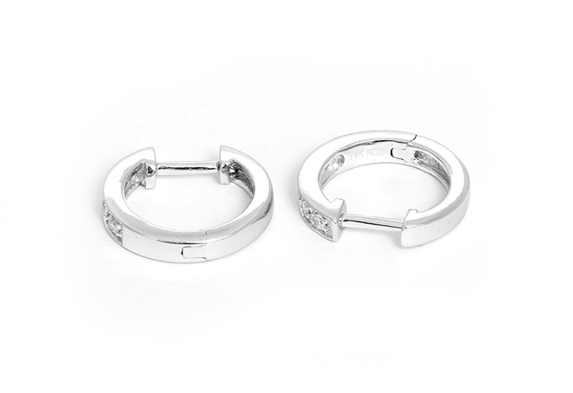 These amazing KC Designs mini hoop earrings feature .10 carats of diamonds set in 14k white gold.  Hoops measure apx. 3/8-inch in length, 1/16-inch in width, and 3/8-inch in diameter. Total weight is 1.9 grams. These hoops are perfect for every day