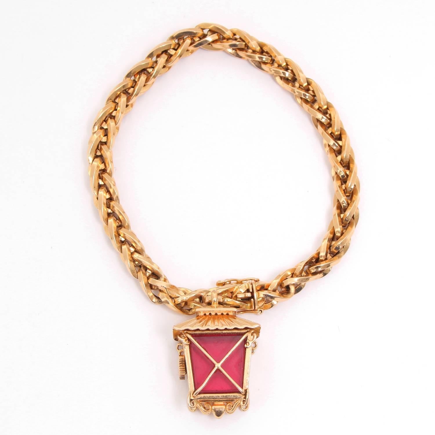 Rolex Lantern Charm Bracelet Watch Circa 1960's -  Manual wind. 18K Yellow Gold; red enamel back. White dial with stink hour markers. 18K Yellow Gold link bracelet. Pre-owned with Rolex box. Case and bracelet are of Rolex manufacture. Extremely