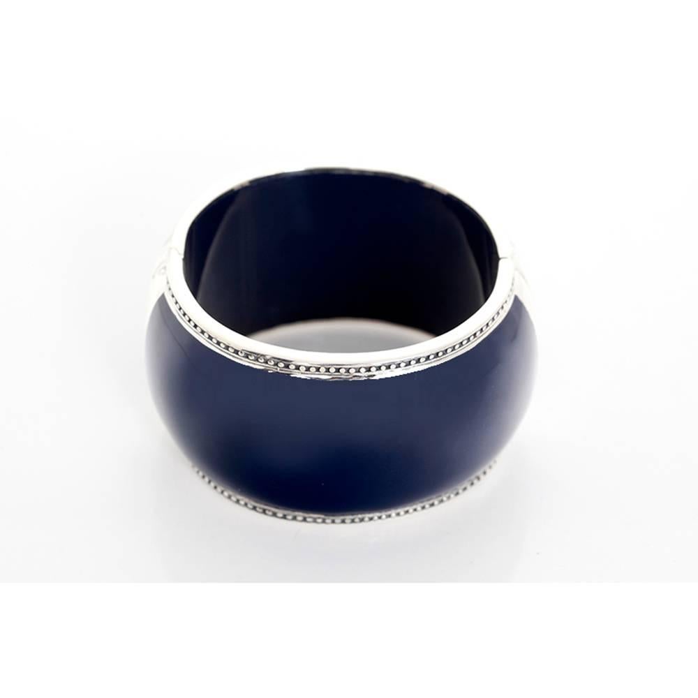  This amazing Miriam Salat navy resin and sterling silver cuff bracelet features a medallion with white and blue topaz. Cuff measures apx. 6-1/2 inches in circumference and apx. 1-1/2 inches in width with a magnetic closure. Total weight is 128.2