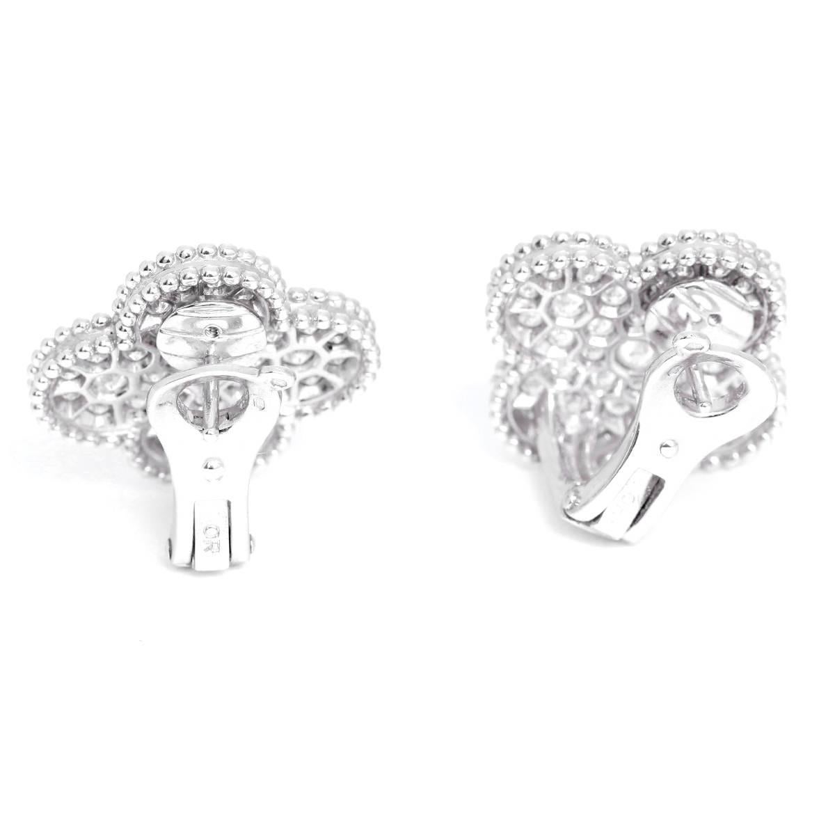 These Van Cleef & Arpels Magic Alhambra, large size earrings feature apx. 2.13 cts of round diamonds; diamond quality DEF, IF to VVS set in 18k white gold. Total weight is 13.7 grams. Signed, VCA AU750 JE547665. Van Cleef certificate and box