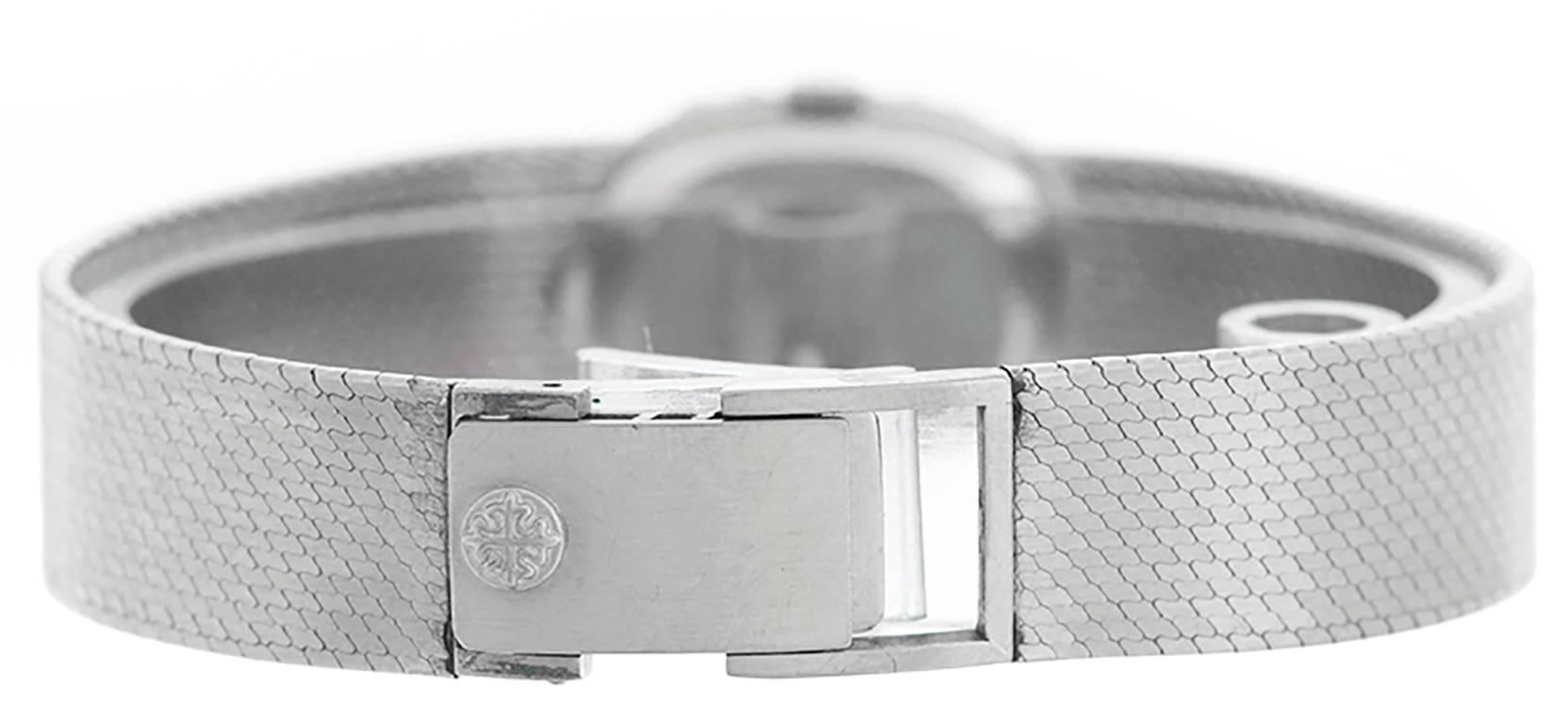 Manual winding. 18k white gold case with Rolex diamond bezel. Silvered dial with stick markers. 18k white gold integrated mesh bracelet (will fit apx. 6 1/4 inch wrist). Pre-owned with original box.