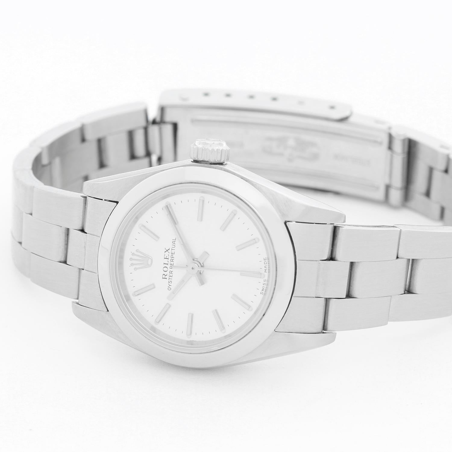 Rolex Ladies Oyster Perpetual No-Date Stainless Steel Watch 67180 -  Automatic winding. Stainless steel case with smooth bezel (25mm diameter). Silver dial with stick markers. Stainless steel Oyster bracelet. Pre-owned with box.