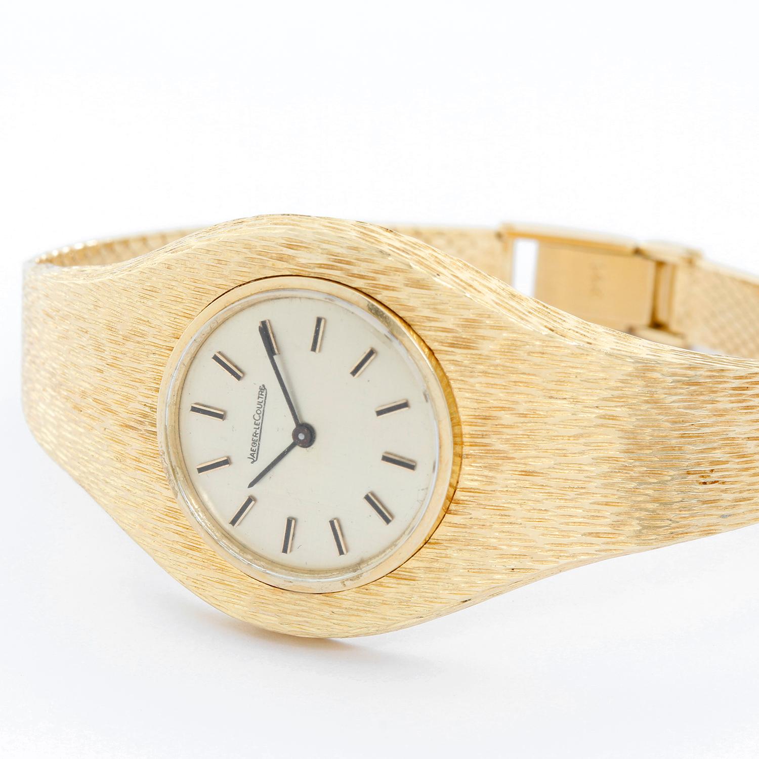 Ladies Vintage Jaeger-LeCoultre 14k Yellow Gold Ladies Retro Style Watch -  Manual winding. 14k yellow gold textured finish case (29mm). Champagne linen finish dial with gold stick markers. Integrated textured 14k yellow gold bracelet (will fit apx.