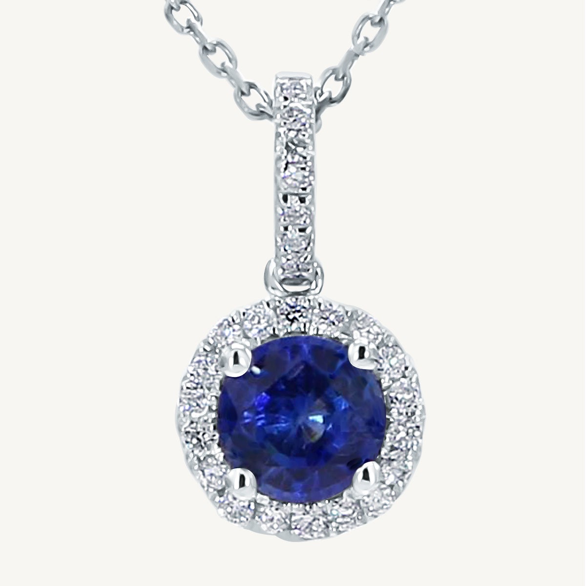Natural Blue Round Sapphire and White Diamond .90 Carat TW White Gold Pendant