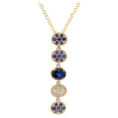 Natural Blue Oval Sapphire and White Diamond 0.76 Carat TW Gold Drop Pendant