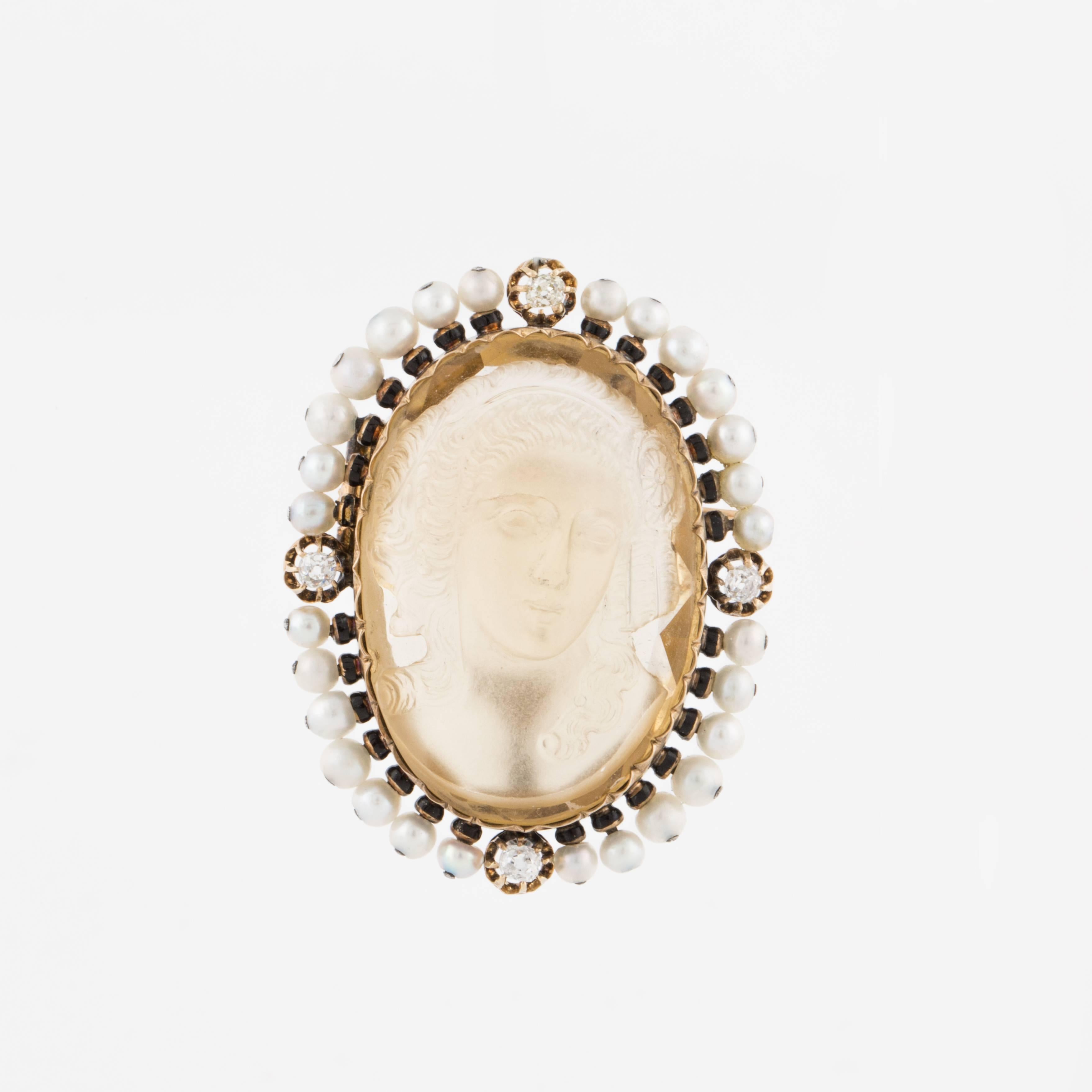 Cameo brooch composed of an 18K rose gold frame with seed pearl and diamond accents, featuring a carved citrine.  The diamonds total 0.50 carats.  It measures 1 5/16 inches long, 1 5/16 inches wide and 5/8 inches deep.  French origin.