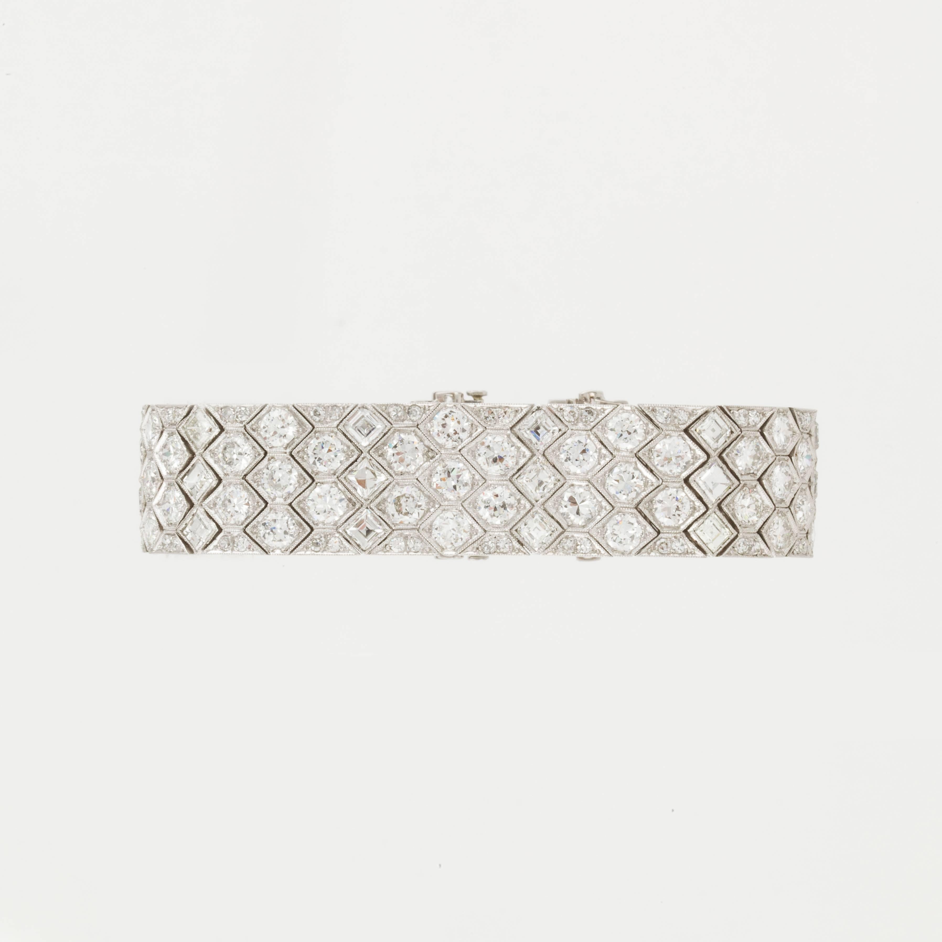 Art Deco platinum honeycomb strap bracelet with round diamonds.  Bracelet consists of 24 Asscher cut diamonds totaling 5.0 carats, 59 full cut diamonds totaling 14.50 carats and 152 single cut diamonds totaling 3.25 carats.  Total diamond weight is